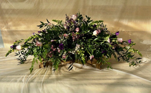 A delicate natural coffin spray